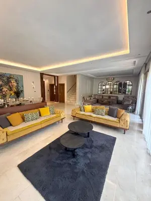 a large living room with couches and a table at Villa 4 Suites with Pool, near Hivernage in Marrakech