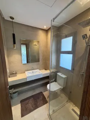 a bathroom with a sink and a toilet and a shower at Villa 4 Suites with Pool, near Hivernage in Marrakech