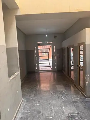 an empty room with a door and a hallway at appartement lumineux familial, vue sur l'océan avec wifi rapide in Marrakech