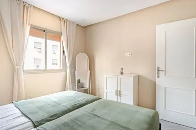 a bedroom with a bed and a window at Idéal Famille Neuf - Fibre Optique - 7 min Guéliz in Marrakech