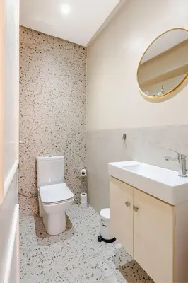 a bathroom with a toilet and a sink and a mirror at Idéal Famille Neuf - Fibre Optique - 7 min Guéliz in Marrakech