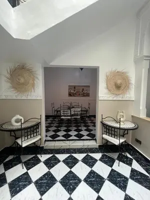 a room with a black and white checkered floor at Ryad N51 G26 in Marrakech