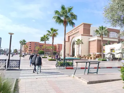 a group of people walking in front of a building at AU GC Gueliz Cosy in Marrakech