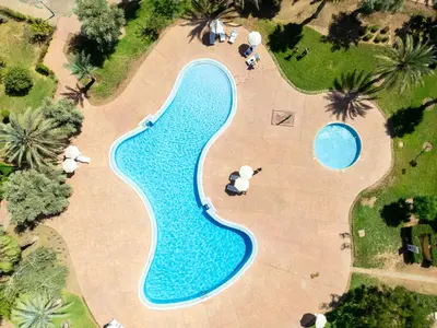 an overhead view of a swimming pool in a resort at Riad azzouina in Marrakech