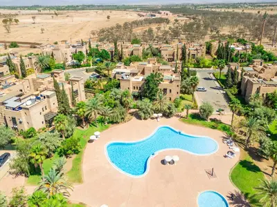 an aerial view of a resort with a swimming pool at Riad azzouina in Marrakech