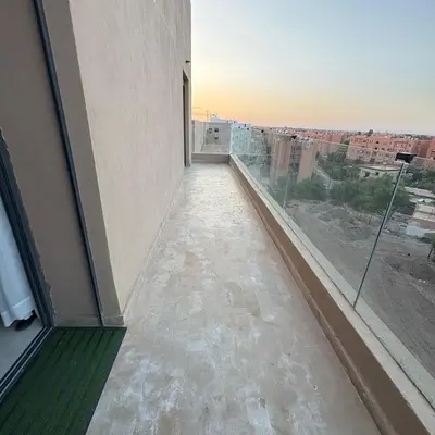 an empty room with a view of a city from a window at Residence hôte standing Marrakech Gueliz in Marrakech