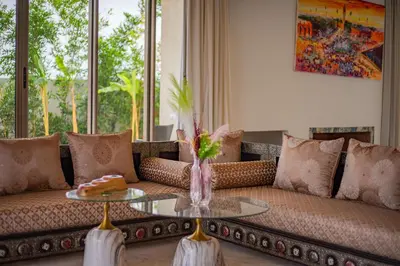 a living room with a couch and a table at Golfside Villas in Marrakech
