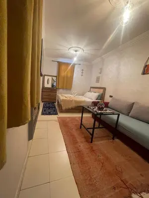 a living room with a couch and a table at La maison de Hamza in Marrakech