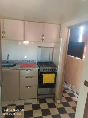 an empty kitchen with a stove and a sink at La maison de Hamza in Marrakech
