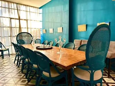a dining room with a wooden table and chairs at Villa Serenity Marrakech in Châba