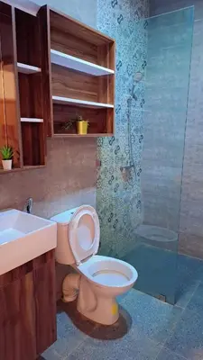 a bathroom with a toilet and a sink and a shower at Appartement Aéroport Palm Marrakech-M9 in Marrakech