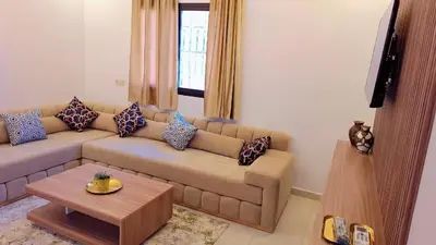 a living room with a couch and a table at Appartement Aéroport Stay Marrakech-M9 in Marrakech