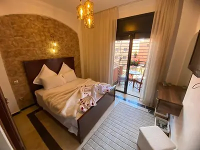 a bedroom with a bed with two dolls on it at Elegance and comfort in the heart of Marrakech in Marrakech