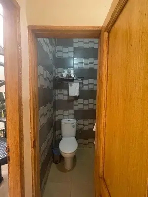 a small bathroom with a toilet in a room at Dar darkoum in Marrakech