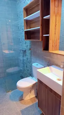 a bathroom with a toilet and a sink and a shower at Appartement Aéroport Marrakech Rest in Marrakech