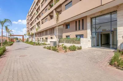 an empty street in front of a building at Modern apartment close to M Avenue & Menara Mall in Marrakech