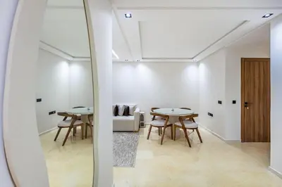 a living room with two tables and a couch at Modern apartment close to M Avenue & Menara Mall in Marrakech