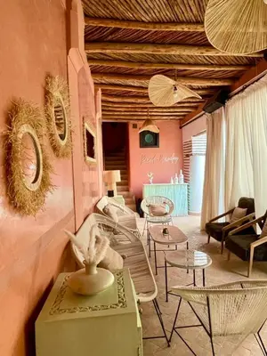 a living room with couches and tables and chairs at Riad Birdy, Charmant et privatif, Piscine, Rooftop, 6 suites, 2 salons, Wifi in Marrakech