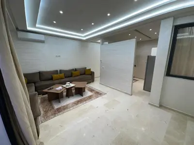 a living room with a couch and a table at Karam eddin in Marrakech