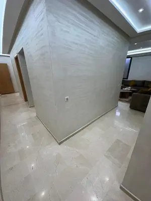 a room with a white wall and a tile floor at Karam eddin in Marrakech
