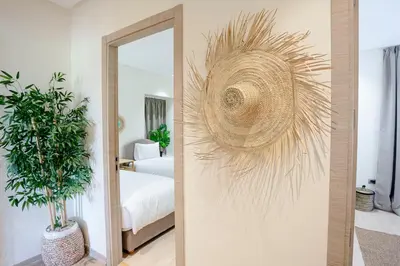 a mirror in a room with a bedroom at Saphire Luxury - Marrakech- Prestigia in Marrakech