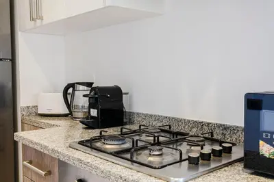 a stove top oven sitting on a kitchen counter at Saphire Luxury - Marrakech- Prestigia in Marrakech