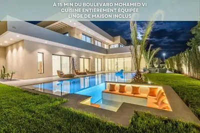 a house with a swimming pool in the yard at Villa Sofya - Roche Bobois Design & HD Wifi in Marrakech