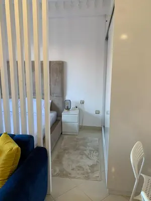 a bedroom with a crib and a bed at Studio Stay Marrakech in Marrakech