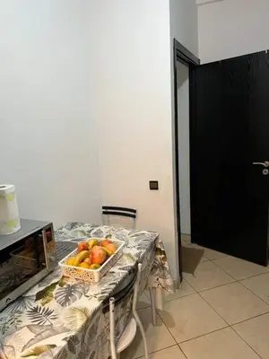 a table with a basket of fruit on it at Modern apartment in the heart of Marrakech, just 9 minutes from the airport in Marrakech