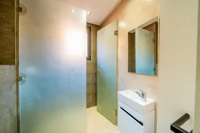 a bathroom with a sink and a mirror at Luxury 5-Suite Villa with private pool in GOLF Amlkis ,free Airport transport service in Marrakech