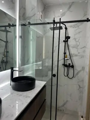 a bathroom with a shower and a sink at M&O airport appartment in Marrakech