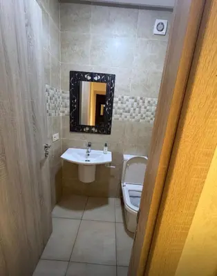 a bathroom with a sink and a toilet at Marrakech résidence Nour 6 in Marrakech