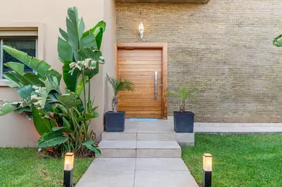 a front door of a house with plants at Zen Villa Private Parking in El Rhechat