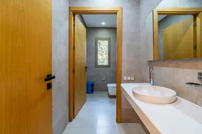 a bathroom with a sink and a toilet at Zen Villa Private Parking in El Rhechat