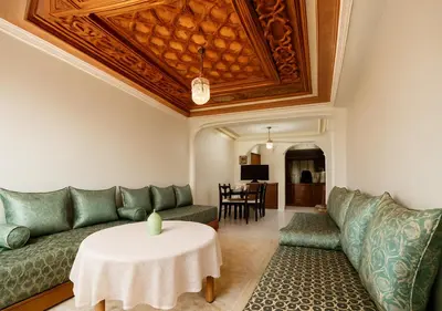 a living room with a couch and a table at Séjour confortables et proche de tous in Marrakech