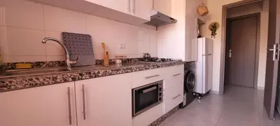 a white kitchen with a sink and a dishwasher at Marrakech Authentic 2-Bedroom flat NearGueliz in Marrakech