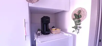 a black coffee maker sitting on top of a refrigerator at Marrakech Authentic 2-Bedroom flat NearGueliz in Marrakech