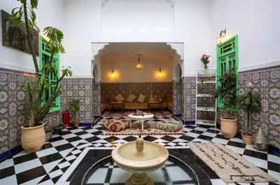a lobby with a couch and a table in a room at Riad Rose Meryam in Marrakech