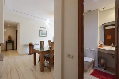 a bathroom with a sink and a toilet and a table at Apartment in the Heart of Marrakech 5th Floor in Marrakech