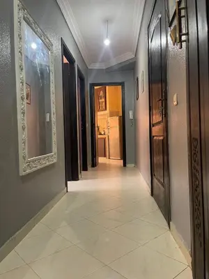 a hallway of a house with a tile floor at Apparemment alhamra in Marrakech