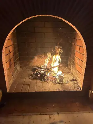a brick oven with a fire in it at Pure havre de paix à Marrakech in Marrakech