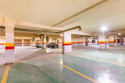 an empty parking garage with cars parked in it at Luxe et Élégance au cœur de Marrakech in Marrakech