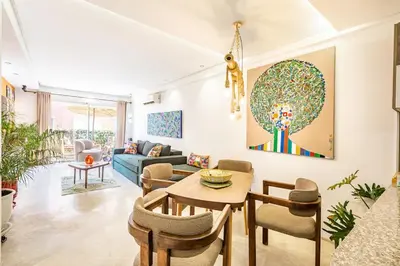 a living room with a table and chairs at Luxe et Élégance au cœur de Marrakech in Marrakech