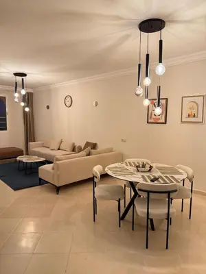 a living room with a couch and a table at Pas disponible in Marrakech