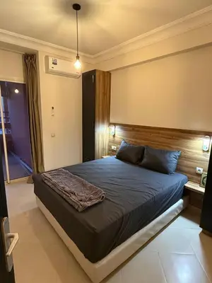 a bedroom with a large bed in a room at Pas disponible in Marrakech