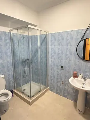 a bathroom with a shower and a toilet and a sink at Pas disponible in Marrakech