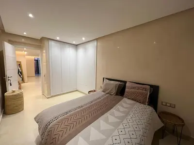 a bedroom with a large bed in a room at Appartement Design près du Jardin Majorelle in Marrakech