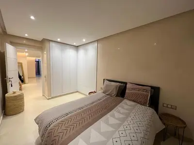 a bedroom with a large bed in a room at Appartement Design près du Jardin Majorelle in Marrakech