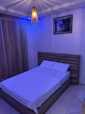 a bedroom with a large bed in a room at Marrakech,Rouidate in Marrakech