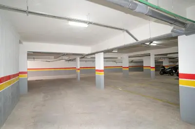 an empty parking garage with columns and motorcycles in it at Comfort Luxe 2BR Pool & Balcony in Marrakech